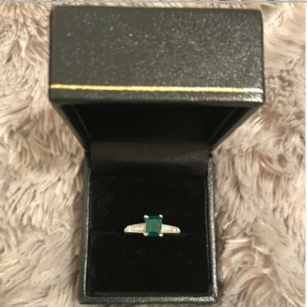 Platinum and Emerald baguette ring with diamonds
